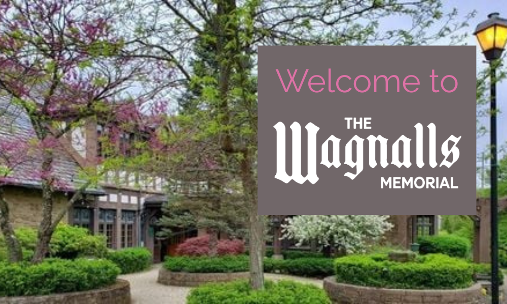 spring trees in front of the Wagnalls' Tudor-Gothic Library entrance